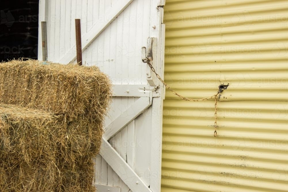 Hay shed door chained open - Australian Stock Image