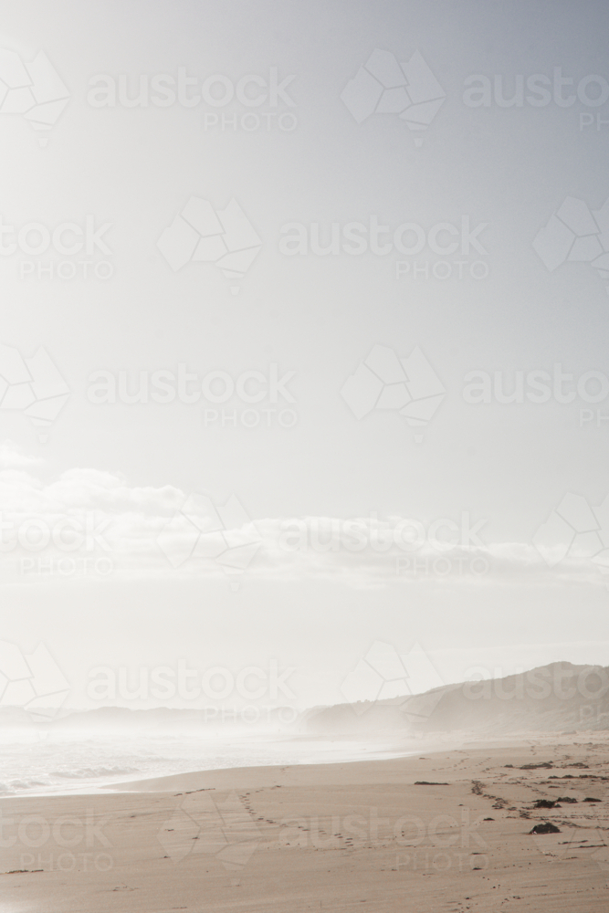 Hazy surf beach with blue sky - Australian Stock Image