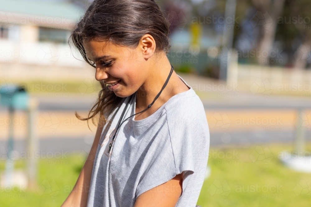 head and shoulders image of young woman in candid casual pose - Australian Stock Image