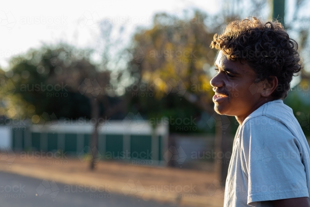 head and shoulders of teen boy in profile - Australian Stock Image