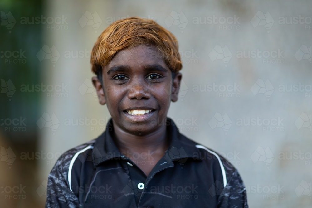 head and shoulders of young boy with dyed hair - Australian Stock Image