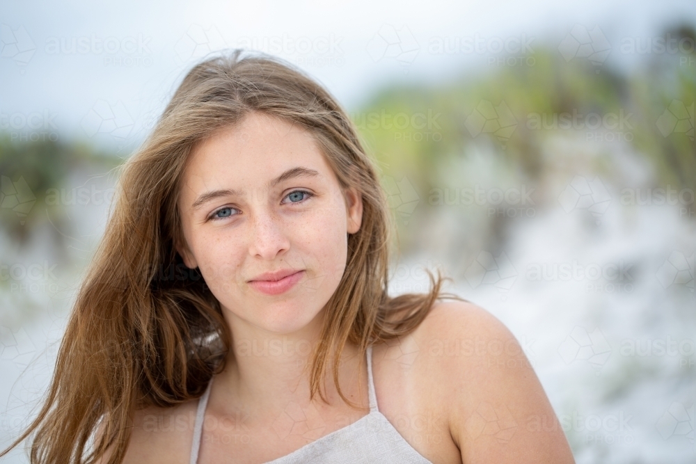 Head and shoulders portrait of teenage girl outdoors - Australian Stock Image