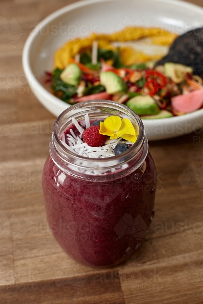 Healthy organic purple berry smoothie drink - Australian Stock Image