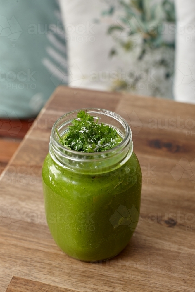 Healthy organic vegan food and drinks on wooden table - Australian Stock Image