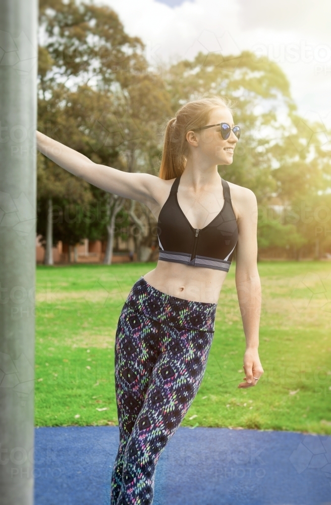Healthy teenage girl training outdoors - Australian Stock Image