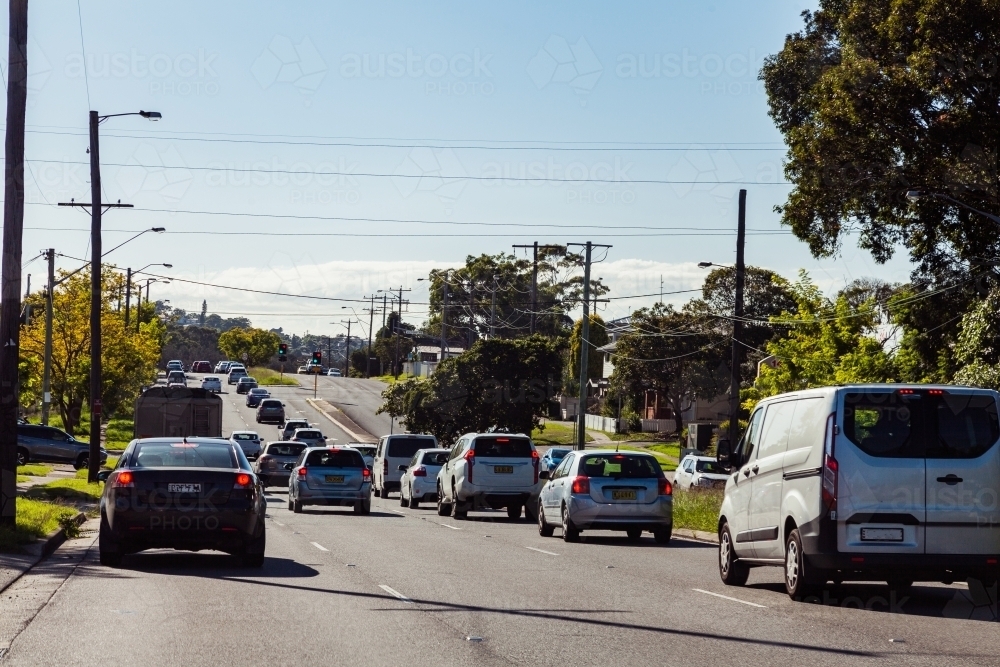 Heavy traffic on multi lane road with break lights on - Australian Stock Image