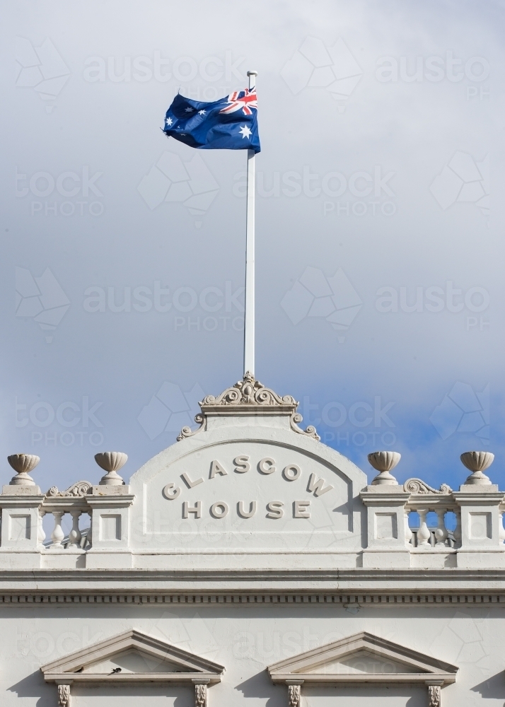 Heritage building with flagpole and australian flag - Australian Stock Image