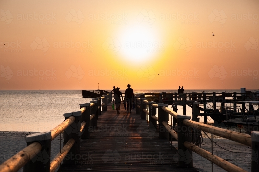 Heron Island Jetty at sunset looking west - Australian Stock Image
