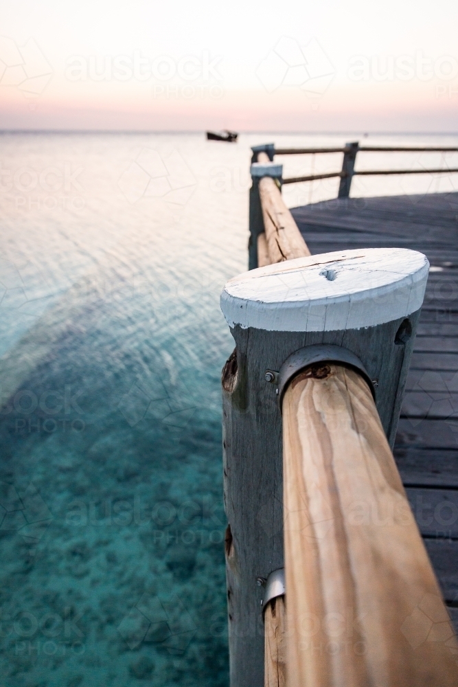 Jetty Railing Design Image of heron island jetty railing at sunset - Austockphoto