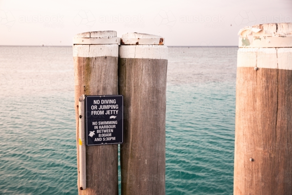 Image of Heron Island jetty with no diving or jumping from jetty sign ...