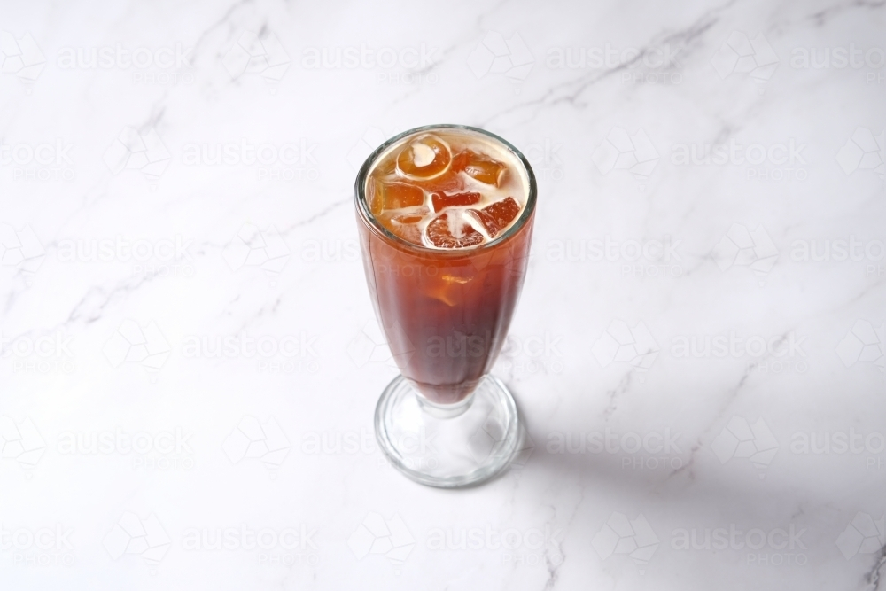 High-angle shot of iced tea in glass - Australian Stock Image