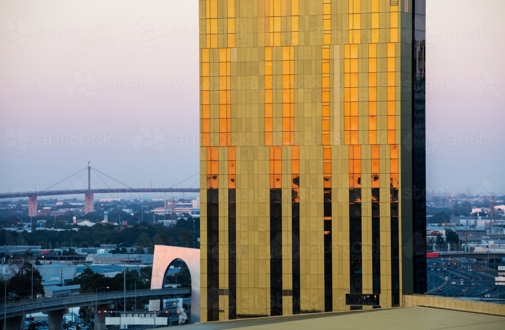 high rise building reflecting sunrise - Australian Stock Image