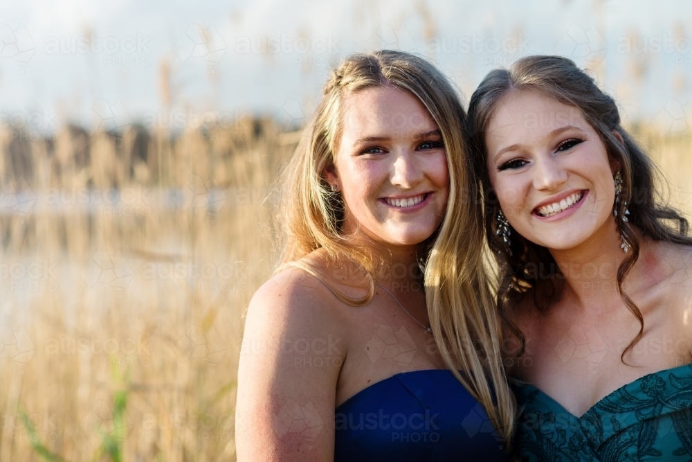 high school formal, two friends posing, with copyspace - Australian Stock Image