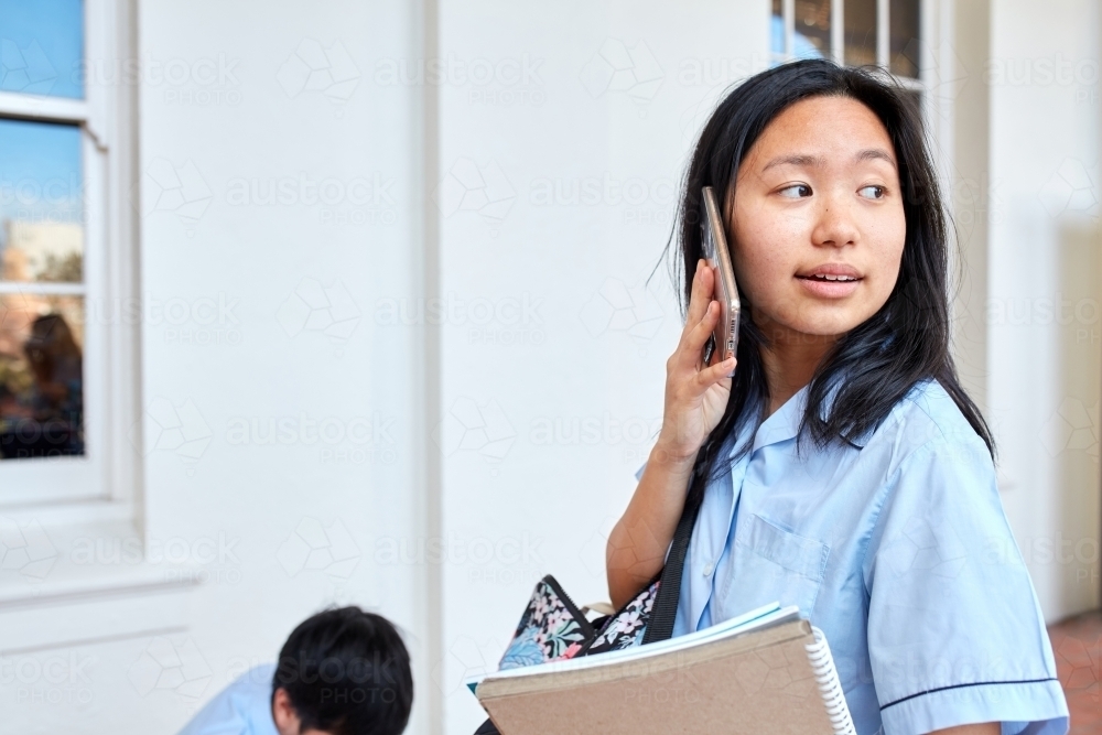 High School student making call on-campus - Australian Stock Image