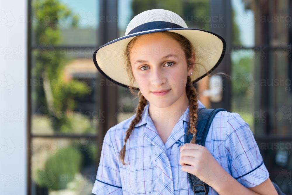 high school student with hat and backpack - Australian Stock Image