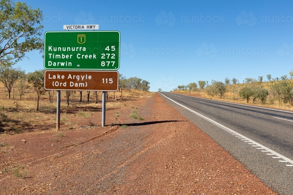 highway on through the Kimberley, with road sign near Kununurra - Australian Stock Image