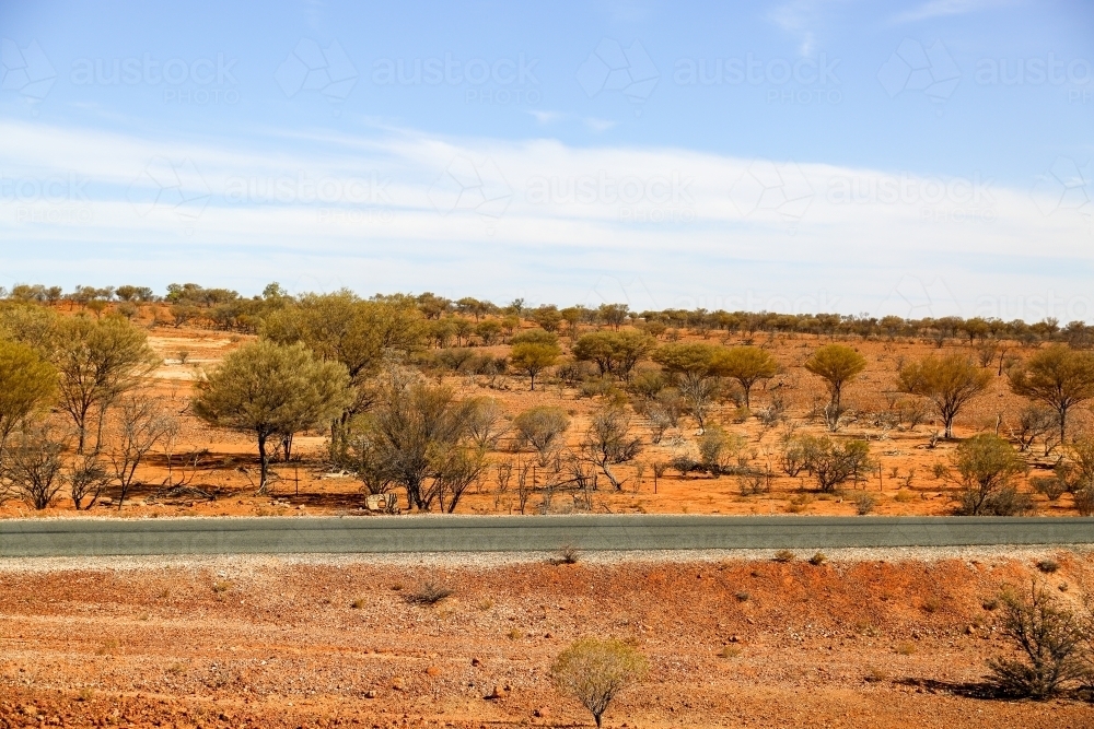Highway through drought in western Queensland. - Australian Stock Image
