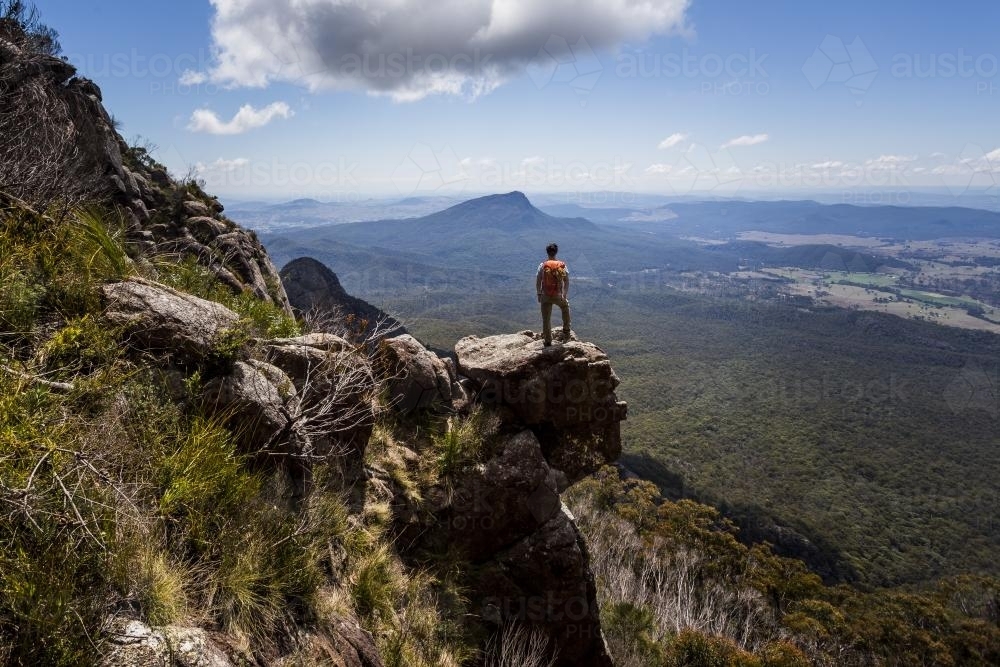 Hiker enjoying the view from Logan's Ridge on Mount Barney - Australian Stock Image