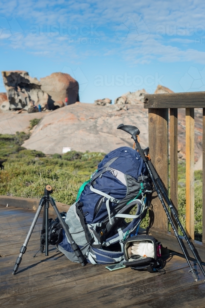 Hiking and photography equipment on boardwalk trail in bushland - Australian Stock Image