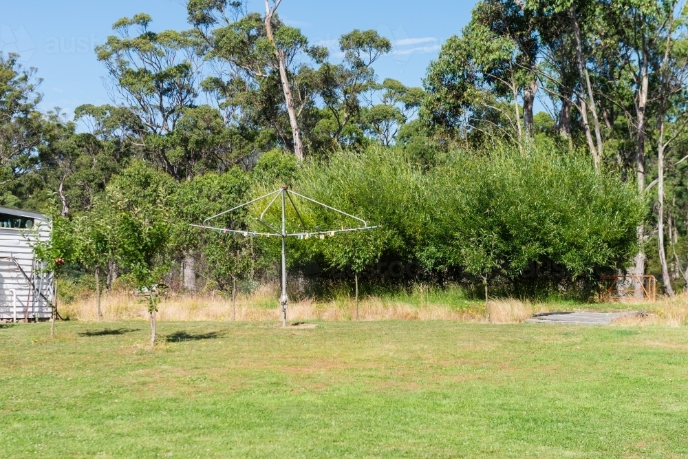 hills hoist clothesline in the backyard - Australian Stock Image