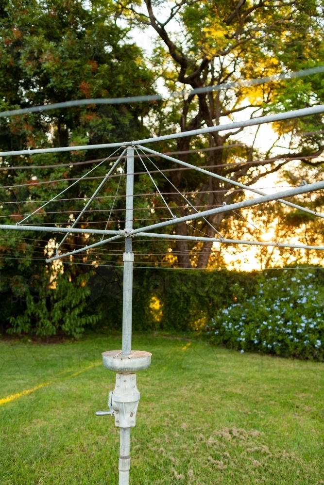 Image of Hills Hoist washing line on neat lawn grass on autumn