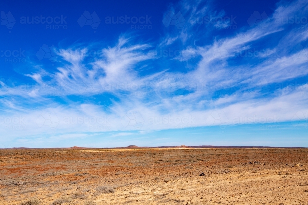 hills on horizon of desert landscape - Australian Stock Image