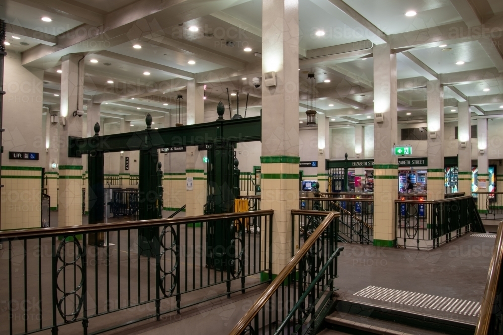 Historic concourse at St James station in Sydney with wrought iron railings and stairs visible - Australian Stock Image