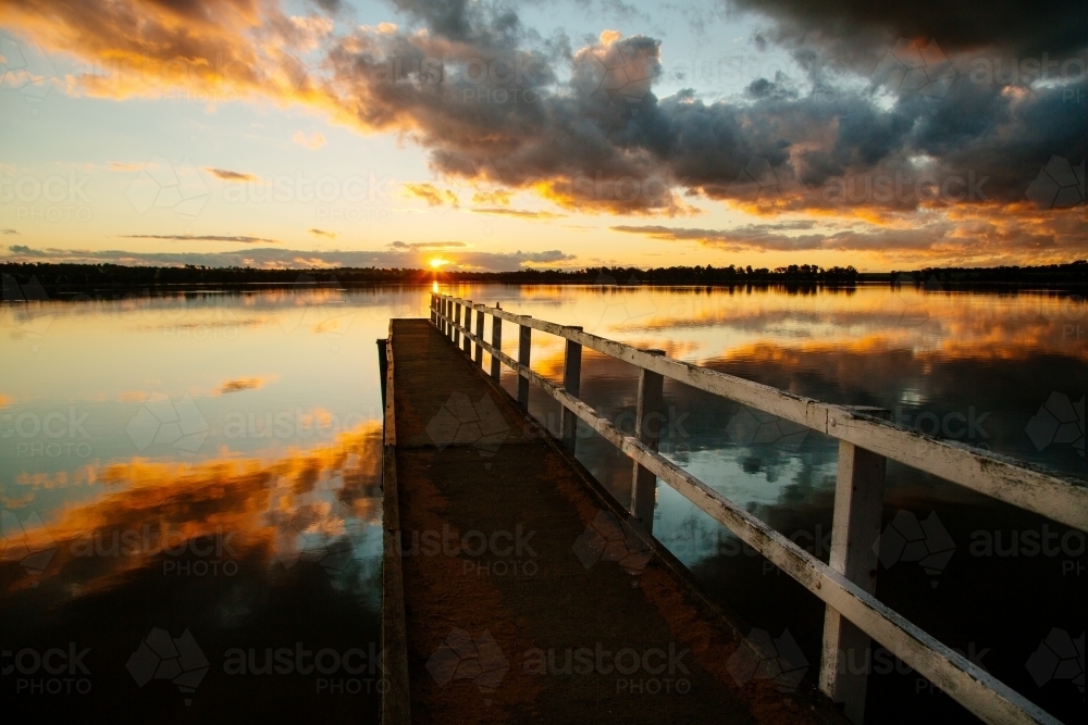 Historic jetty at sunset on Lake Towerrinning - Australian Stock Image