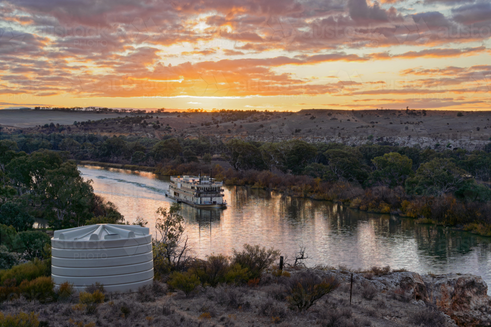 Historic Paddle Steamer boat Cruising on the Murray River at Sunset - Australian Stock Image