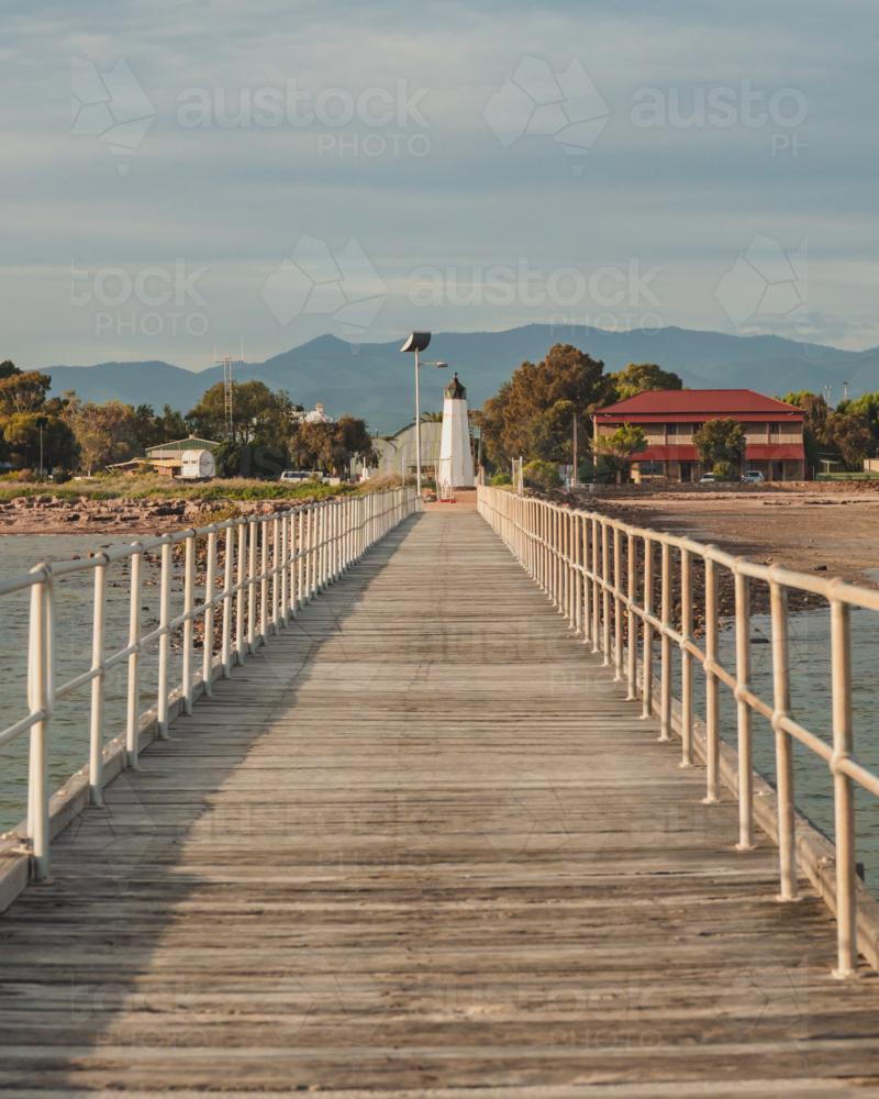 Historic Port Germein Jetty with Flinders Ranges in the Background, South Australia - Australian Stock Image