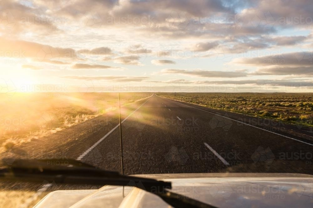 Hitting the road at sunrise in outback Northern Territory - Australian Stock Image