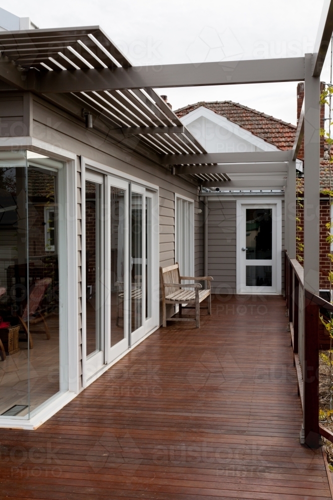 Home extension of weatherboard, merbau decking and steel with bench - Australian Stock Image