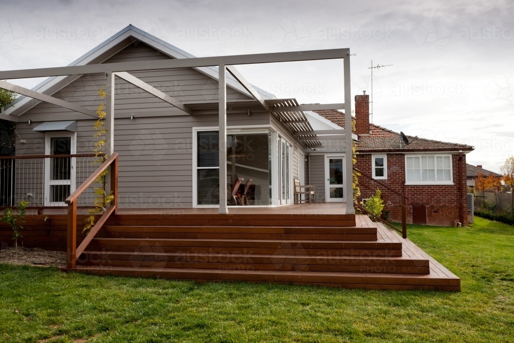 Home extension of weatherboard, merbau decking and steel with bench - Australian Stock Image