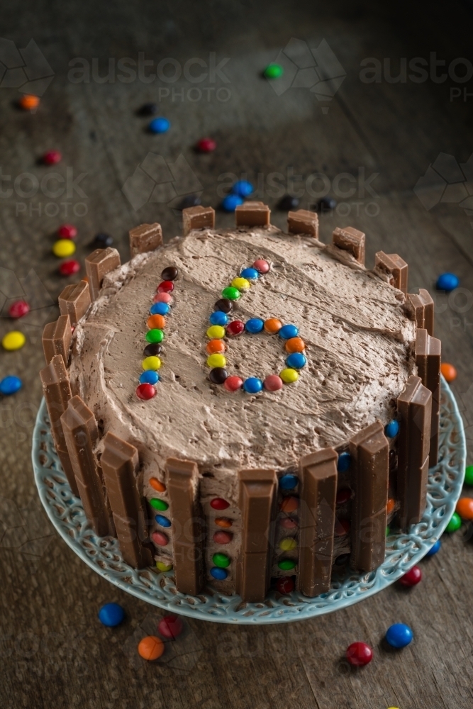 home made chocolate cake with 16 in chocolate candies - Australian Stock Image