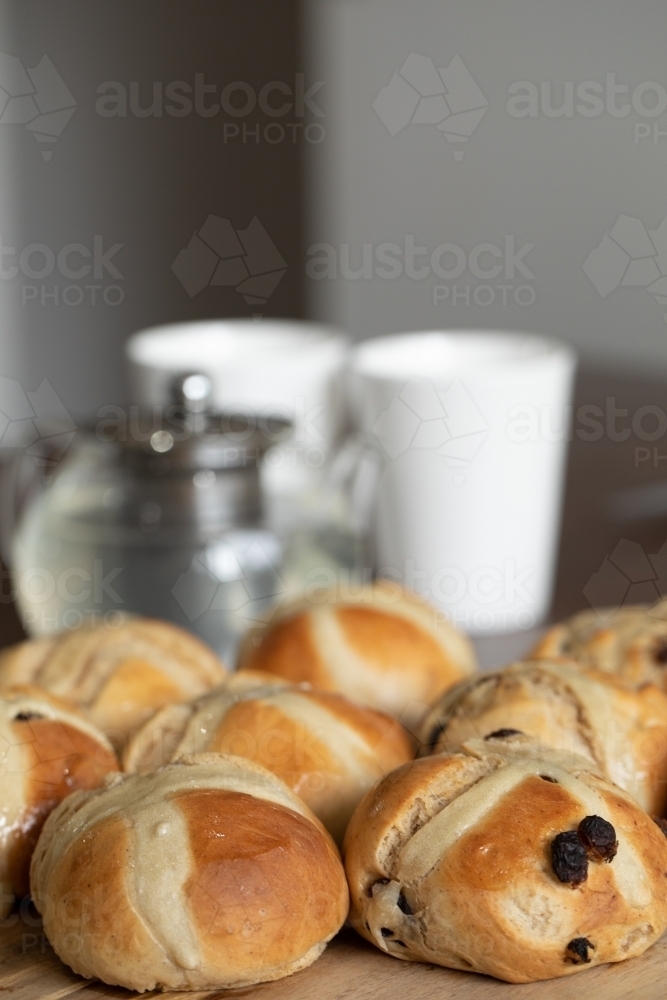 homemade hot cross buns on the table ready for smoko - Australian Stock Image