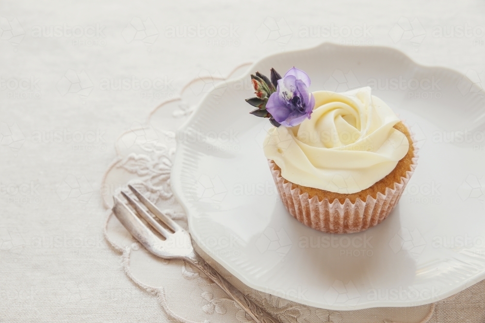Homemade vintage rose cupcakes with edible flowers - Australian Stock Image
