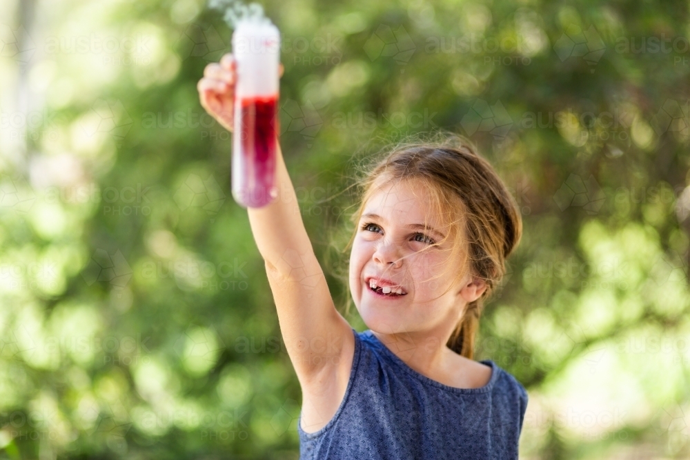 Homeschool kid doing science experiment with dry ice, water and soap - Australian Stock Image