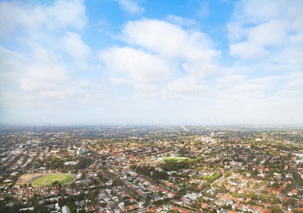 Horizon hazy with smoke over houses and streets in Sydney city - Australian Stock Image