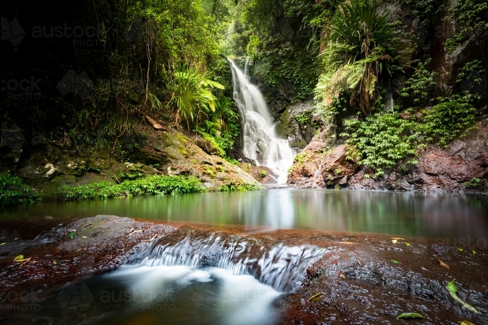 Horizontal shot of a creek and waterfall - Australian Stock Image