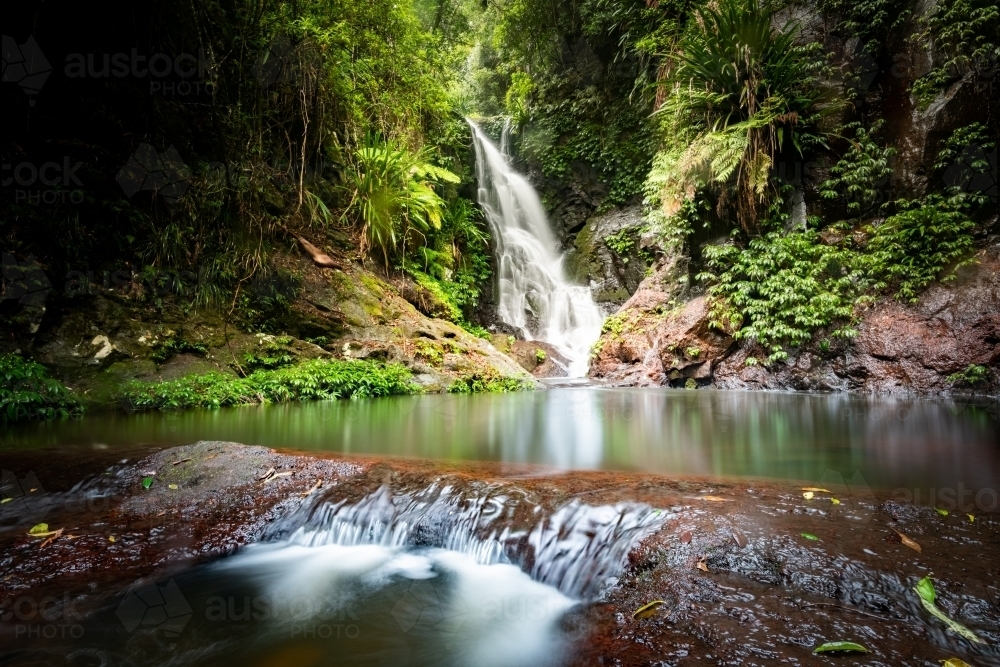 Horizontal shot of a creek and waterfall - Australian Stock Image