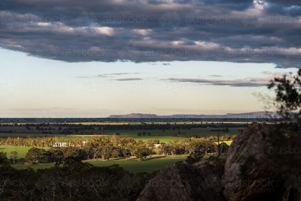 Horizontal shot of a farmland under a cloudy sky - Australian Stock Image