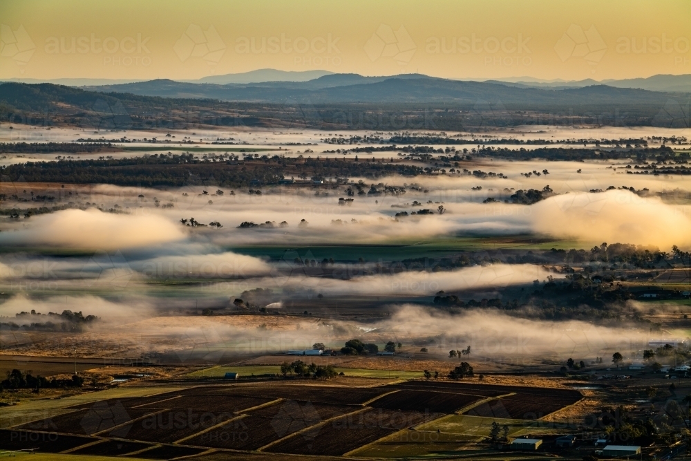 Horizontal shot of a farmland under a cloudy sky - Australian Stock Image
