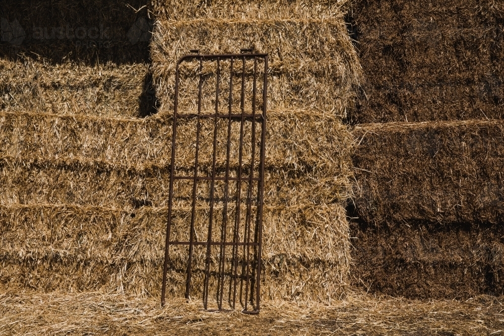 Horizontal shot of a Hay Bales stored in a shed on rural property - Australian Stock Image