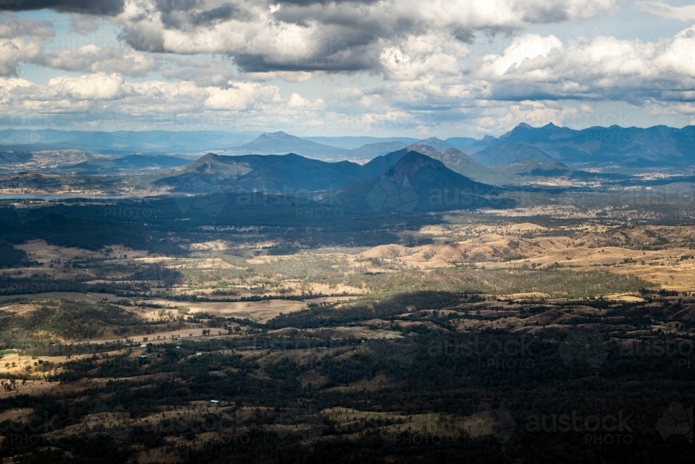 Horizontal shot of a landscape on a cloudy day in a mountain valley - Australian Stock Image