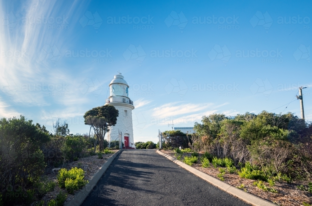 Horizontal shot of a lighthouse under blue and white skies - Australian Stock Image