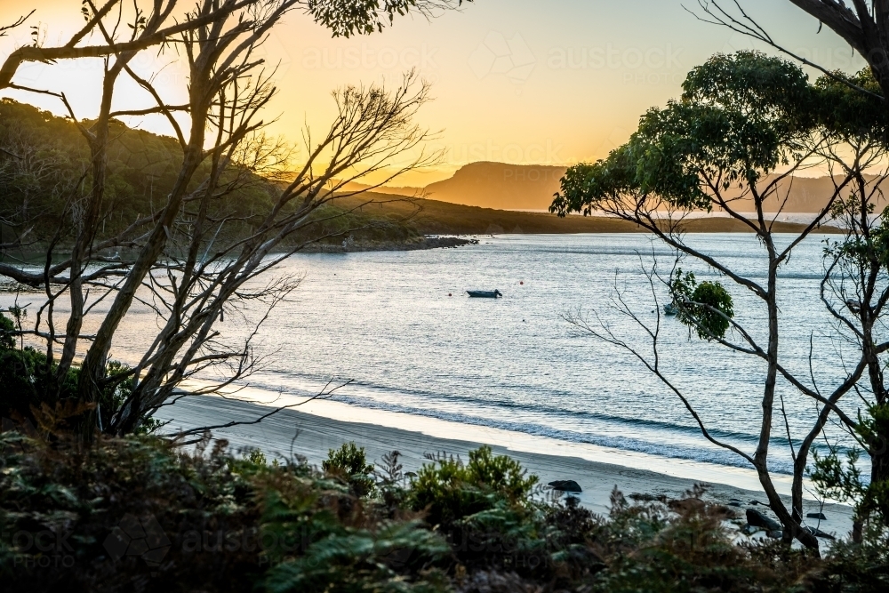 Horizontal shot of a serene sunset sky by the beach - Australian Stock Image