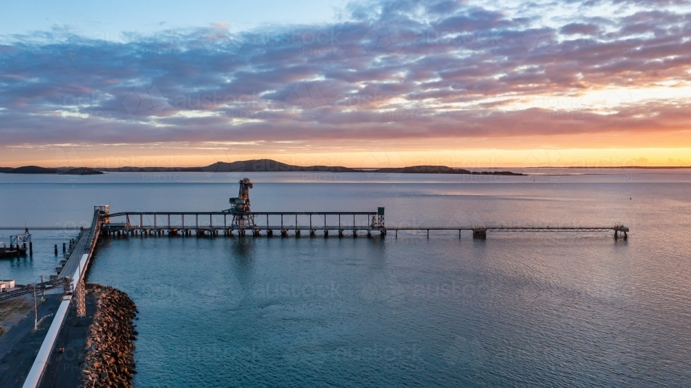 Horizontal shot of a wharf at sunset - Australian Stock Image