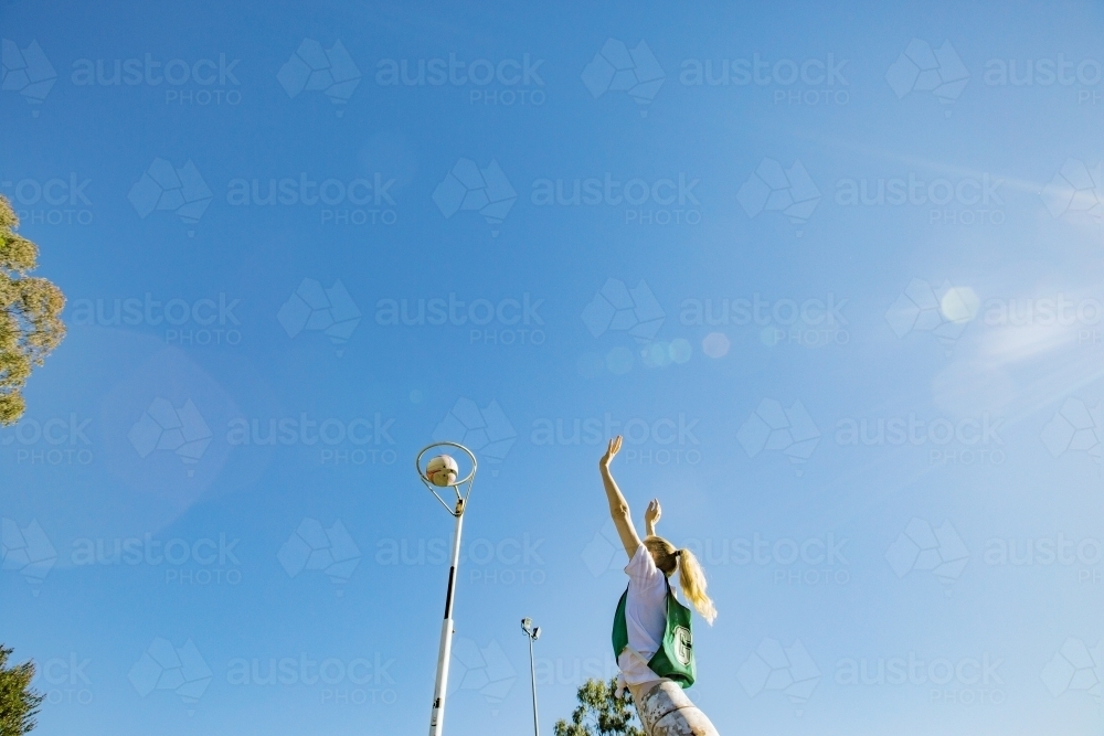horizontal shot of a young woman celebrating after scoring in a net ball game - Australian Stock Image