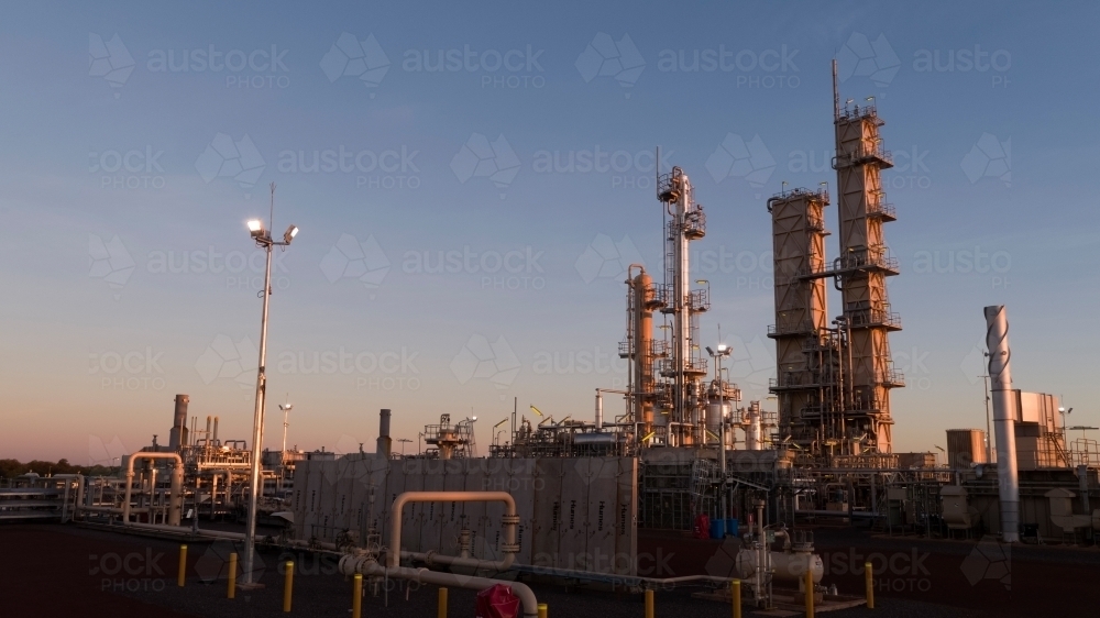 Horizontal shot of an industrial plant at dawn - Australian Stock Image