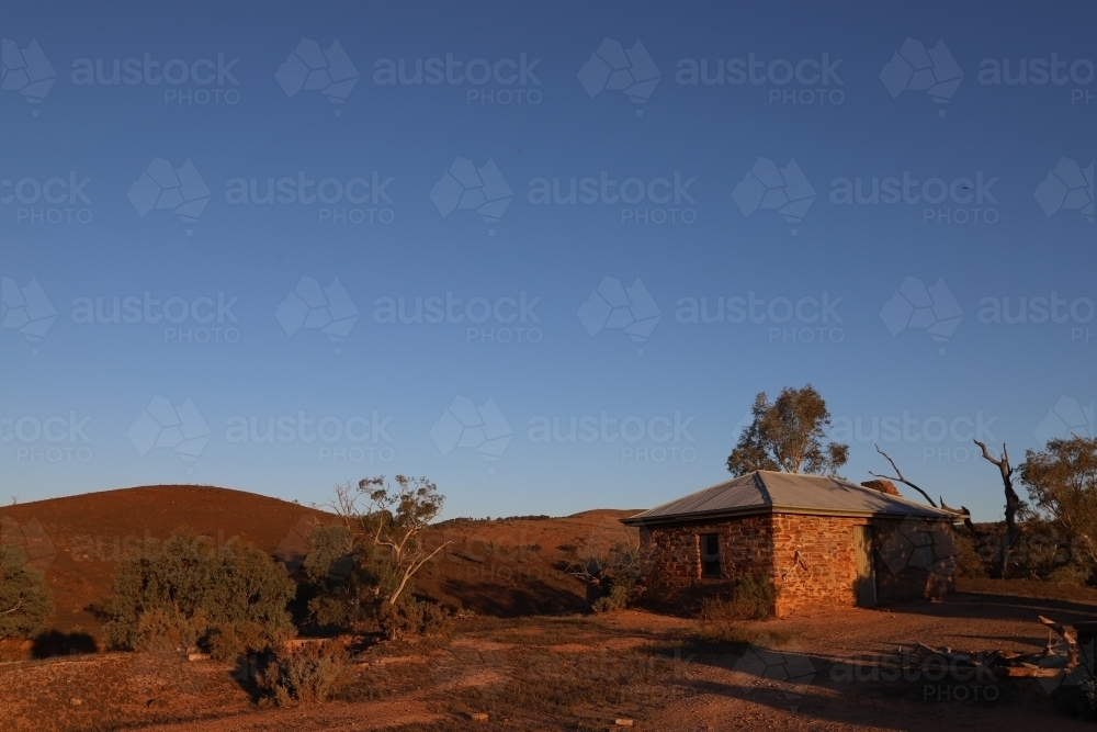 Horizontal shot of an old abandoned house on the hill top - Australian Stock Image